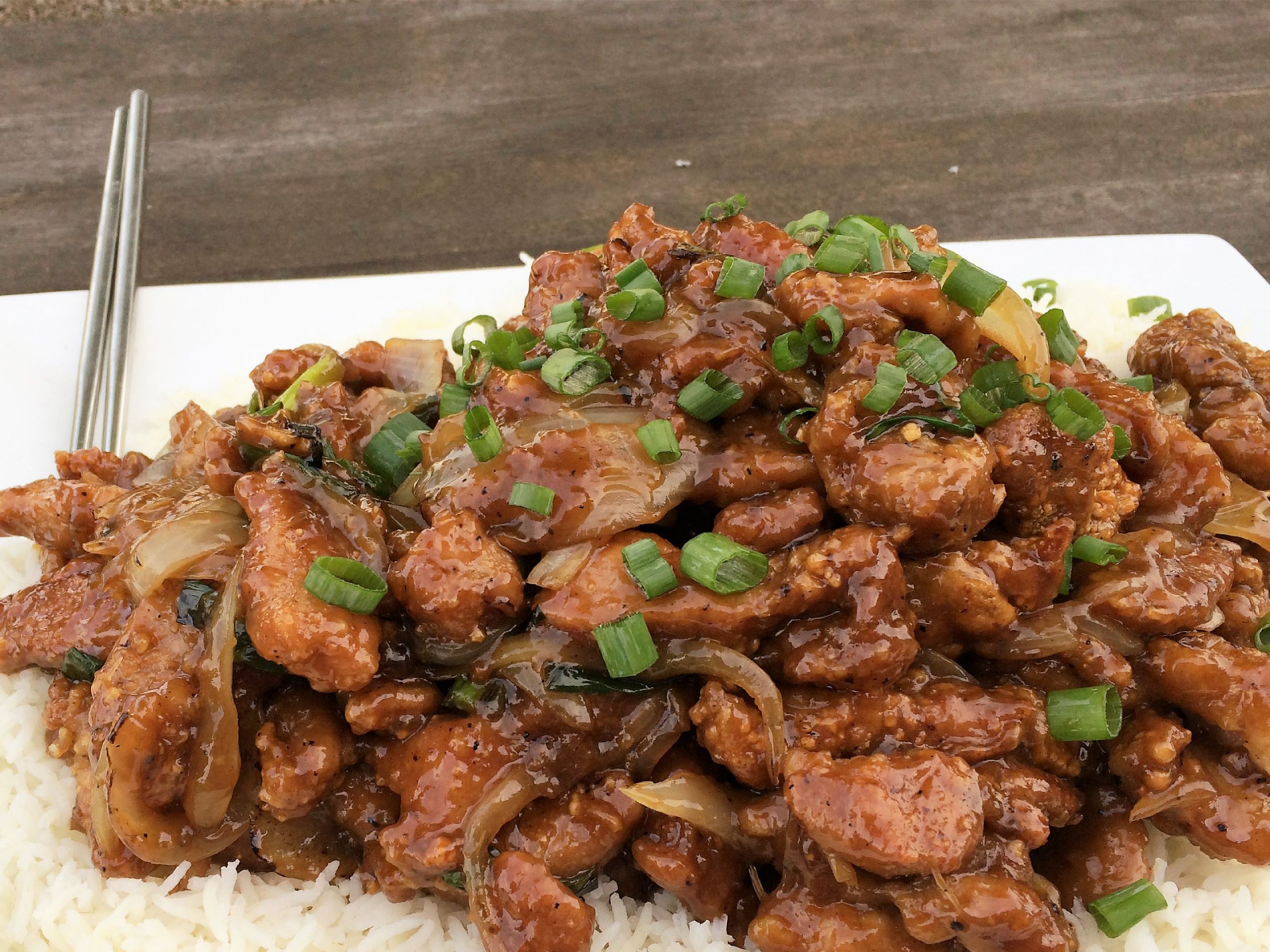 Move over Mongolian beef! This Crispy-Sweet Pork and Onions recipe delivers tender pork, caramelized onions, and a finger-licking sauce. Yes, it's a little messy, but you'll forgive it after the first bite.