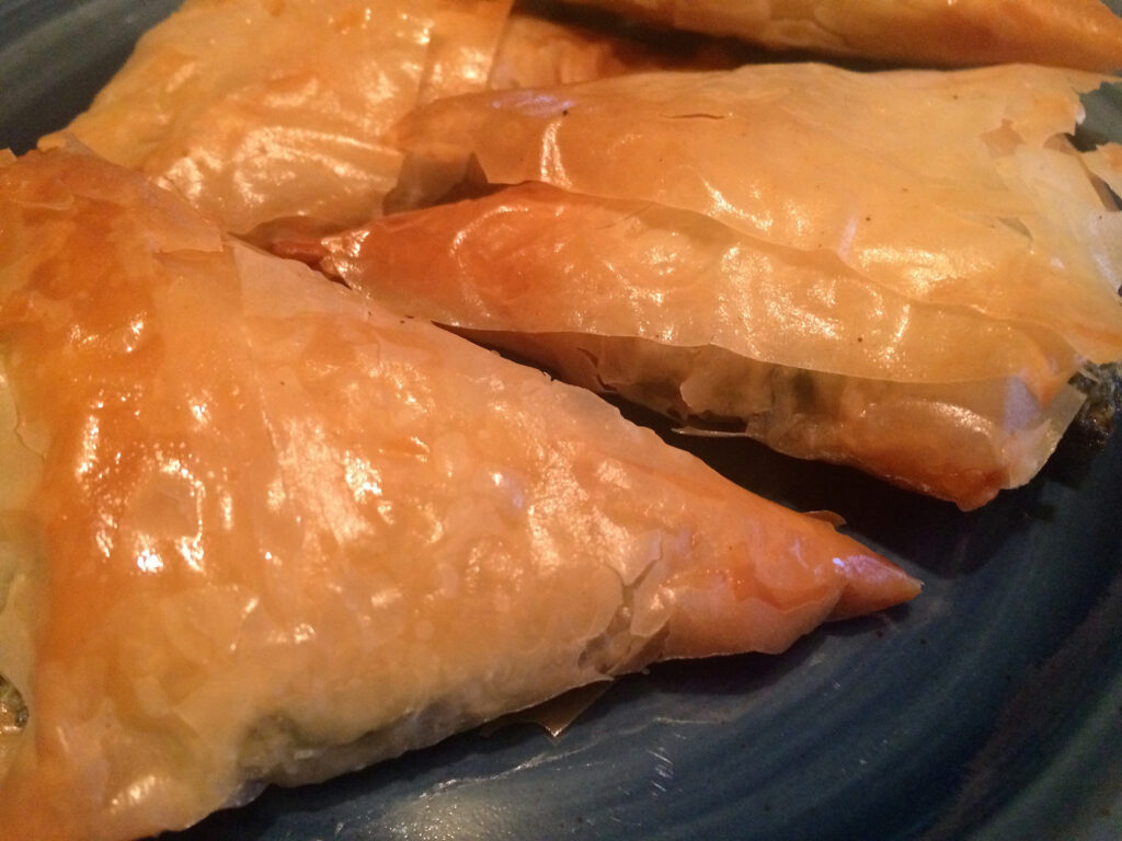 Spanakopita, the Greek pastry of dreams, is crispy on the outside, cheesy on the inside, and totally worth the effort. Whether you fold it into perfect little triangles or go the lazy 9x13 pan route, it’s always a crowd-pleaser.