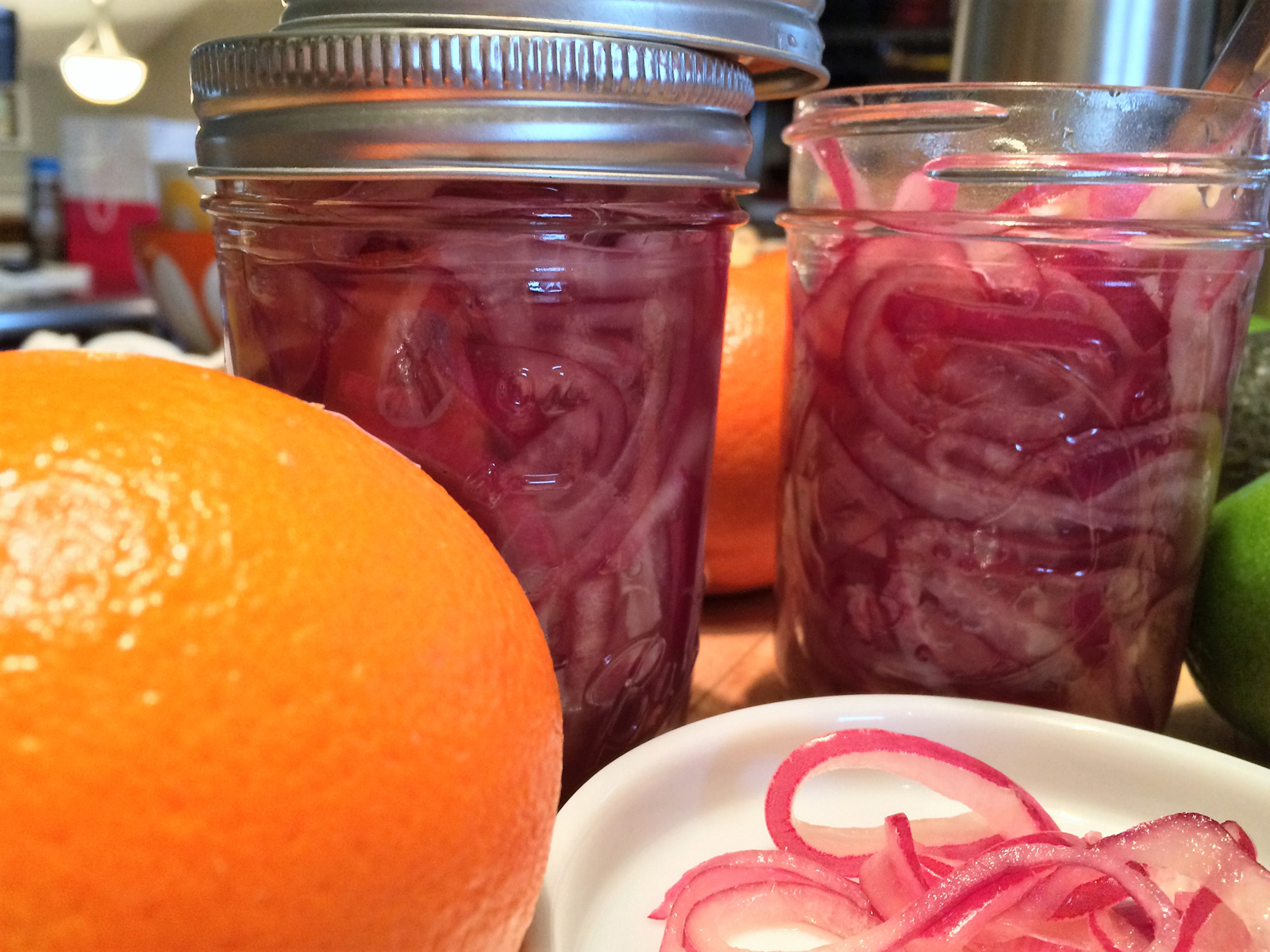 These pickled red onions are a tangy, slightly sweet, and downright magical addition to tacos, sandwiches, or anything that needs a zing of flavor. Quick, simple, and a total flavor bomb!